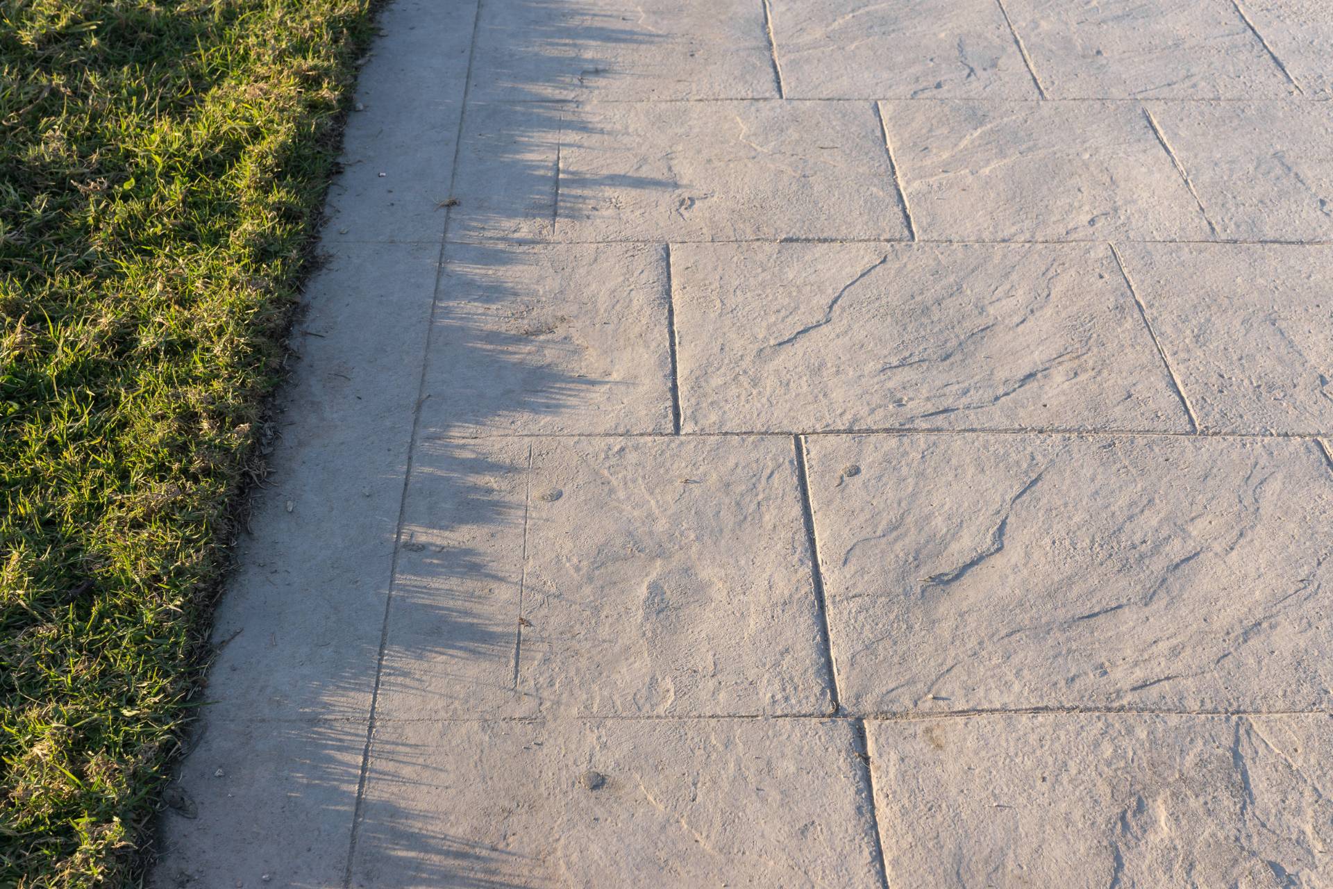 Concrete walkway stamped in a slate pattern.