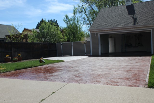 A slippery stamped concrete driveway in Joliet, IL that was treated with concrete sealer.