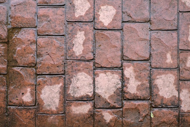 Red cobblestone stamped concrete pattern.