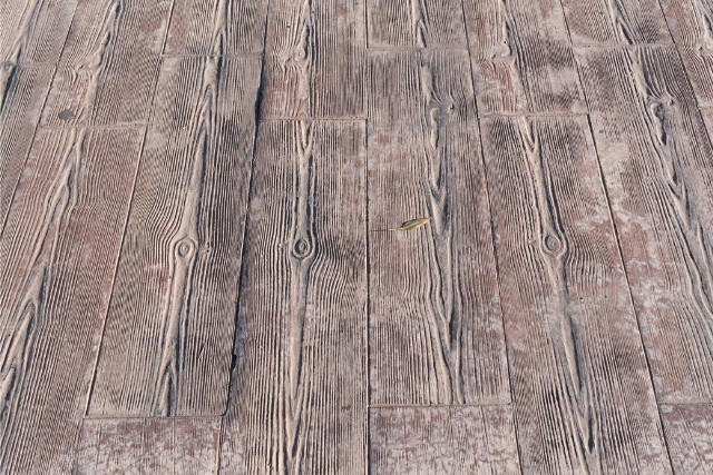 Wood plank pattern stamped on concrete patio.